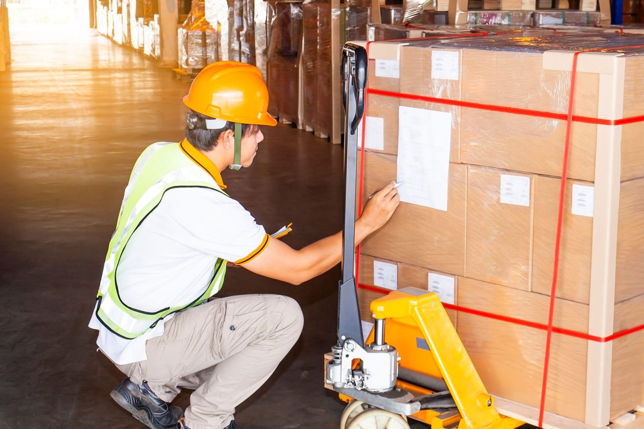 a man doing inspection of boxes